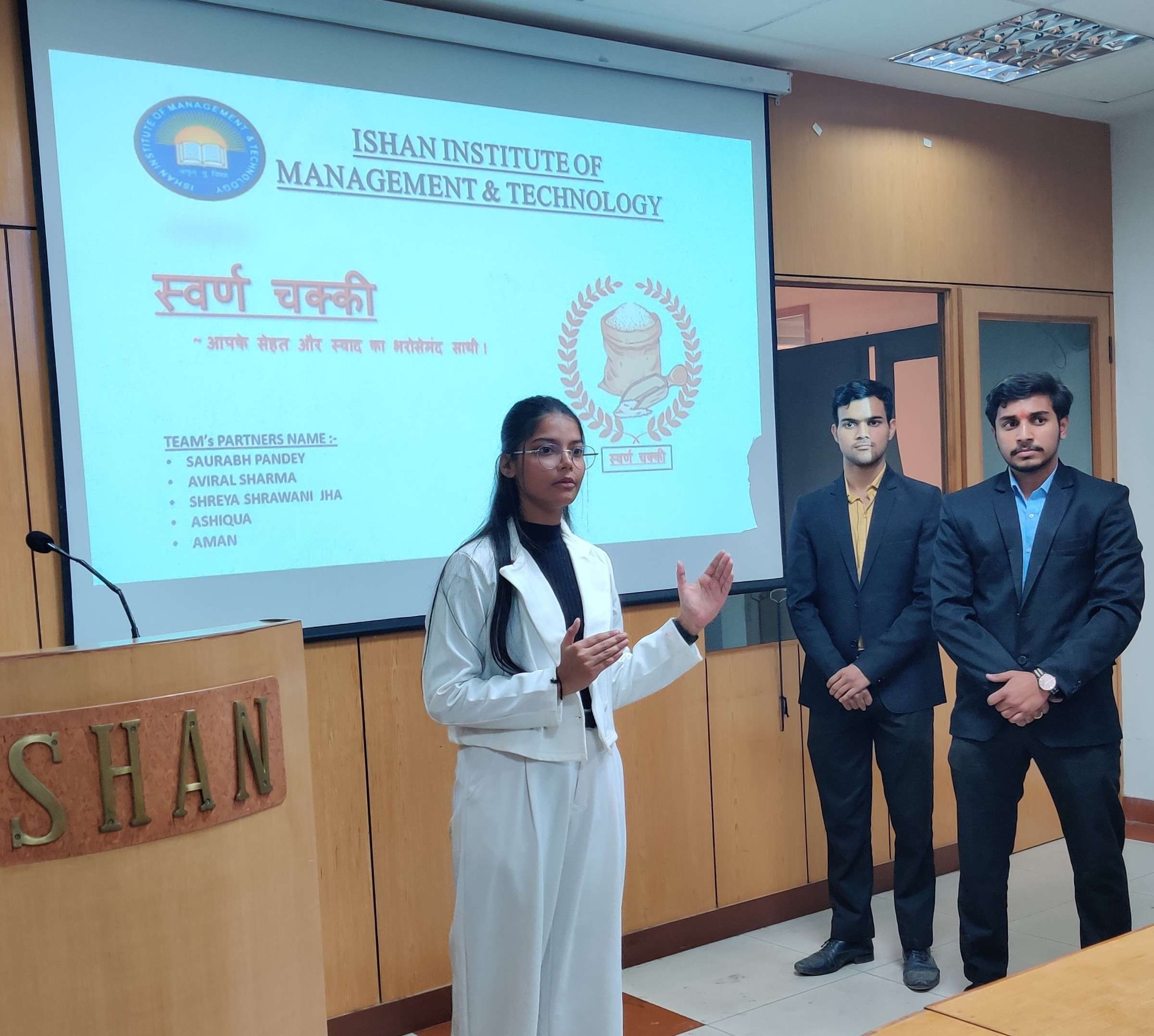 Top Ishan IIMT B.Com students presenting innovative business ideas confidently.